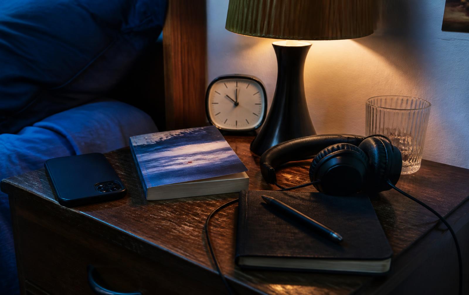 A phone set aside beside a table in late afternoon light